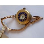 A lady's early 20th century 9-carat yellow-gold cased half hunter wristwatch; blue-enamelled dial (