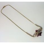 A fine quality white-gold, ruby and diamond necklace   (The cost of UK postage via Royal Mail