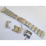 A Rolex Oyster expandable steel bracelet for a wristwatch End markings are '57' on concave link to