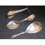 An Orientalist silver spoon and pusher set marked TuckChang sterling and engraved with bamboo