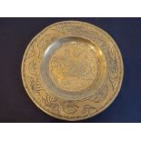 An early/mid-20th century circular Chinese brass dish; centrally engraved with a dragon and with a