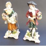 A pair of late 19th century continental hand-decorated porcelain figures; male and female with game,