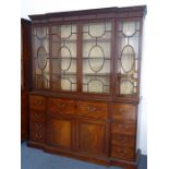 A very fine late 18th century breakfront mahogany library secretaire bookcase; the dentil cornice