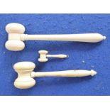 Three late 19th/early 20th century turned ivory auctioneer's gavels (the largest 16.5cm, the