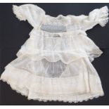A circa 1900s lace and muslin child's dress; ivory-coloured muslin with matching Brussels lace