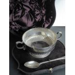 A heavy cased 19th century hallmarked silver two-handled bowl and spoon set (original case);