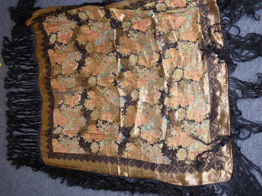 An early 20th century shawl; fine floral decoration in gold-coloured thread and with long black - Image 2 of 4