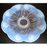 An Art Deco period flower-head-shaped glass dish exhibiting opalescence; the underside in high