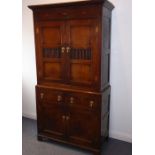 A good 18th century North Country-style oak food cupboard of slim proportions; outset cornice