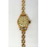 A ladies 9-carat gold 'Cyma' bracelet watch (10.6g) (The cost of UK postage via Royal Mail Special