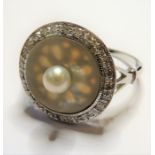 An 18-carat white-gold, pearl, mother of pearl and diamond ring; ring size  (The cost of UK
