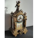 A 19th century gilt-metal eight-day mantle clock with Sèvres-style porcelain panels decorated with
