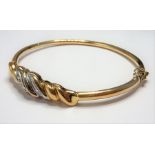 A 9-carat gold and diamond bangle (total weight approx. 8.58g) (The cost of UK postage via Royal