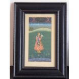 An ebonised framed and glazed Indian watercolour/gouache study of a standing gentleman of finery