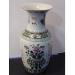A 19th century Chinese porcelain vase of baluster form; the flaring neck decorated with a two