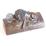 A circa late 19th/early 20th century small carved wooden model of the 'Lion of Lucerne' after