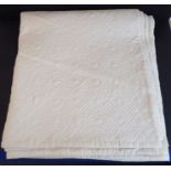 A hand-stitched, double sided, all-white Durham quilt; central four-point motif radiating with