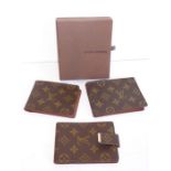 Louis Vuitton, a boxed collection; a leather card wallet and two further similar card wallets (3)