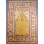 A 19th century Turkish silk prayer rug having unusual yellow ground centre (184cm x 124cm)
