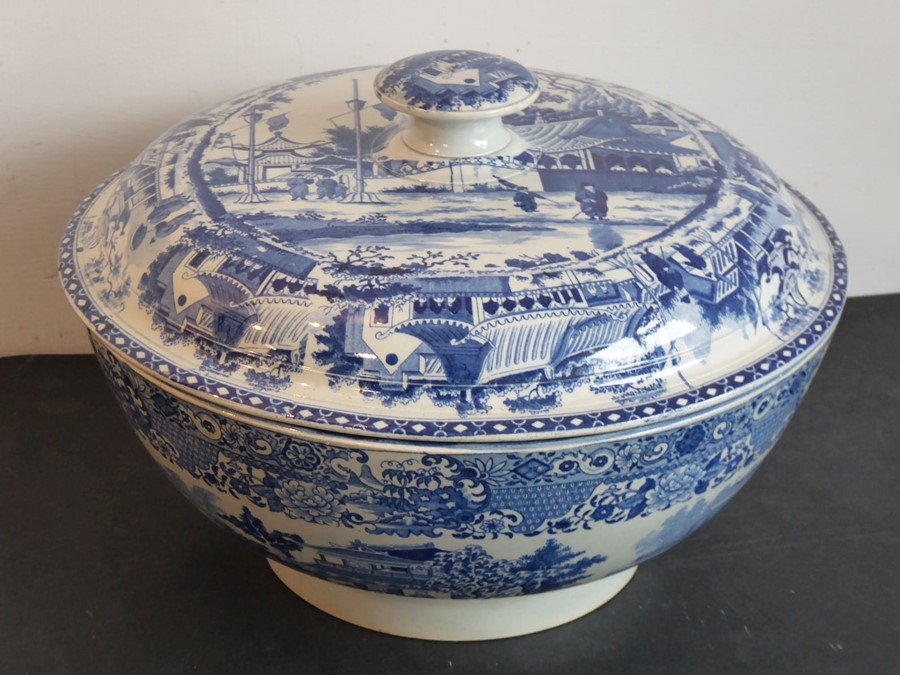 An early 19th century blue-and-white transfer decorated pearlware punch bowl and circular cover; the