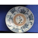 17th/18th century, a Chinese blue-and-white provincial heavy porcelain dish; stylised decoration