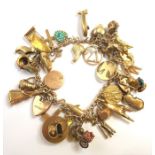 A mid-20th century 9-carat rose-gold charm bracelet complete with rose-gold, 9-carat and yellow-