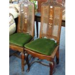 A good and unusual pair of late 17th/early 18th century high-back chairs; the top rails carved