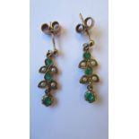 A pair of emerald and half pearl ear pendants, each designed as two trefoils suspending a circular-