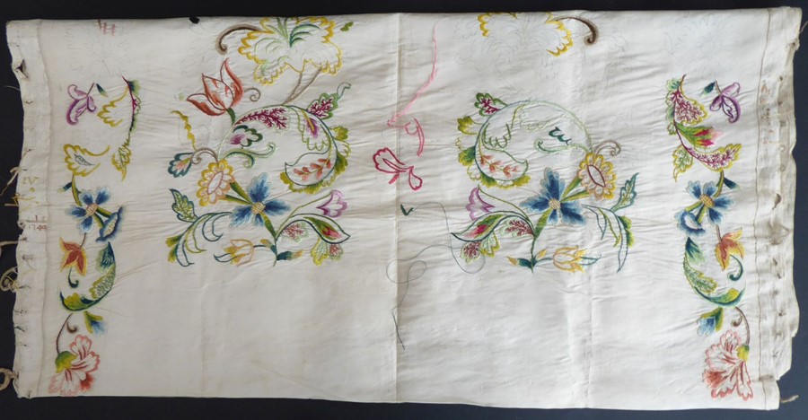 An unfinished silk embroidery with one edge embroidered with '1744'; ivory-coloured silk with a