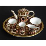 A miniature Royal Crown Derby coffee service comprising coffee pot (7.5cm high inc. cover), tea