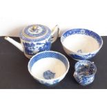 An early 19th century porcelain group; to include a teapot and cover, two bowls each decorated