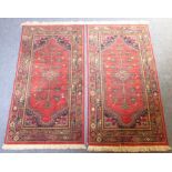 A pair of north-west Persia Hamadan runners with red ground (approx. 165cm x 89cm)