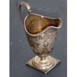 A George III period helmet-shaped neo-classical-style hallmarked silver cream jug; gadrooned rim and