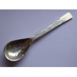 A heavy handmade and planished hallmarked silver teaspoon; the underside with a rat with large tail,