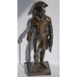 A 19th century patinated bronze of a soldier in bicorn hat; in his left hand he holds a scroll and