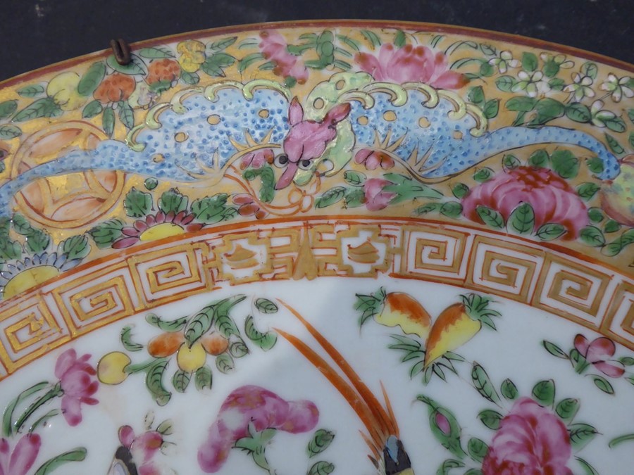 A 19th century Chinese Canton porcelain charger; hand decorated in the famille rose palette; the - Image 2 of 6