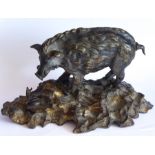 A heavy 19th century bronze sculpture of a male wild boar looking down on a snail in his path (