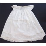 A 1930s Happy Days baby's cotton nightgown; ivory cotton lawn with white work details and applied