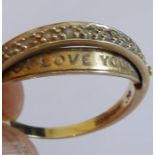 An unusual 9-carat yellow-gold ring horizontally mounted with ten small diamonds (.10) and with