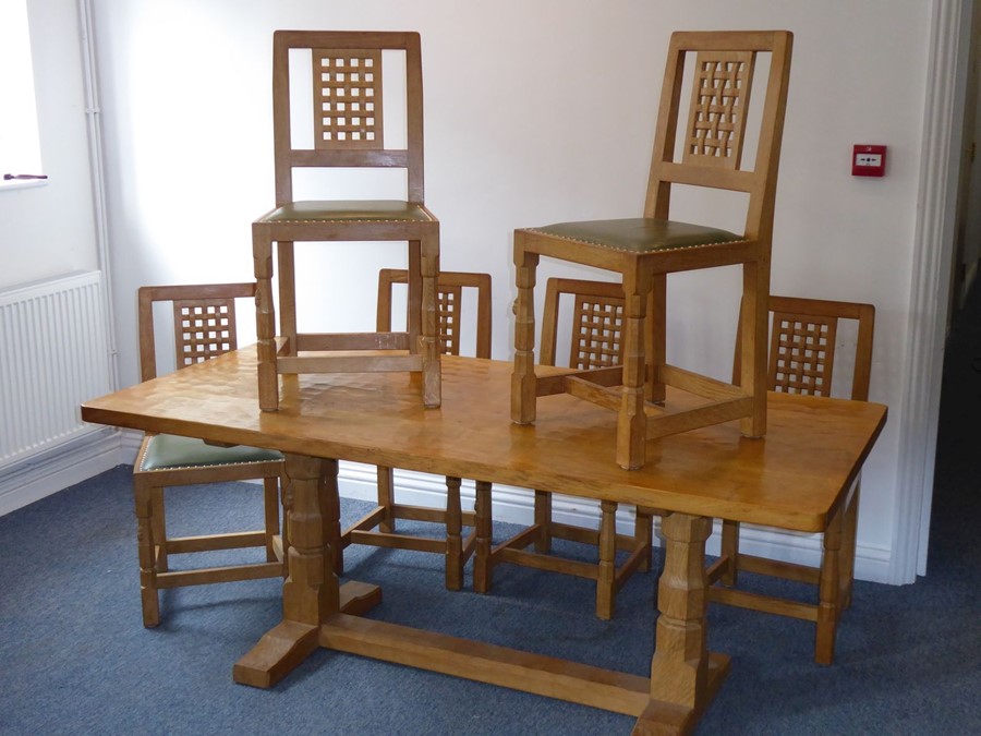 A fine Robert 'Mouseman' Thompson of Kilburn refectory dining table together with six lattice back