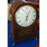 An early 19th century eight-day mahogany and brass-inlaid bracket clock; cream dial with Roman