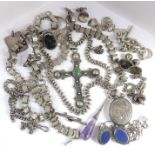 A small collection of Victorian and later silver jewellery including a large Latin cross with