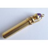 A late 19th/early 20th century gold (marks rubbed) fob pencil; the handle finial mounted with a