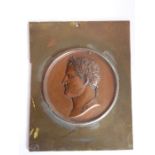 An early 19th century Grand Tour copper relief of Napoleon (as Caesar); the head in profile and