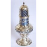 An ornate hallmarked silver caster having pierced domed top; the main body decorated repoussé