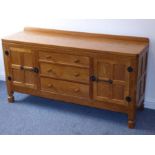 A good Robert 'Mouseman' Thompson of Kilburn oak sideboard; the galleried back adjoining to an adzed