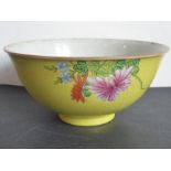 A 19th century Chinese porcelain yellow-ground scrafitto bowl; the feathery scroll incised ground