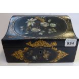 A mid-19th century papier-mâché stationery box; the ogee-shaped lid inlaid with mother of pearl as