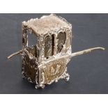 An unusual hallmarked silver model of a sedan chair with opening front panel (possibly by Sampson