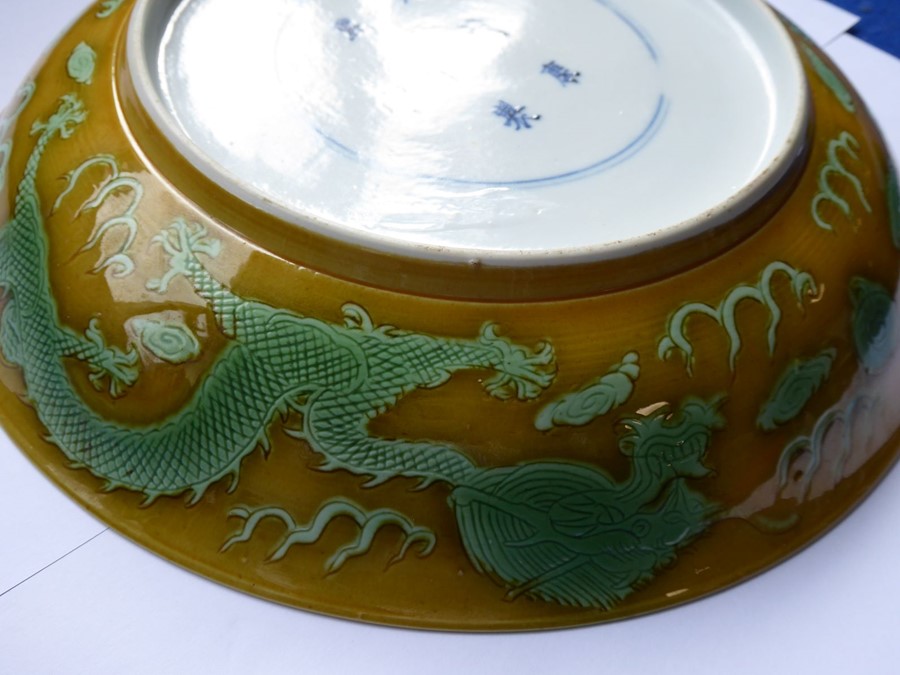 A Chinese porcelain scrafitto dish; three green dragons chasing pearls amongst clouds against an - Image 8 of 9